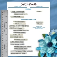 A chart displays 13 metal font samples for stamping the “Follow Your Heart It Knows The Way Key Ring,” labeled by size with a ruler. Blue text marks unicase and case styles. A blue flower decorates the corner, and a note flags small caps as hard to read for “Among Wildflowers.”. Read more at Stamping Cat Studio (stampingcatstudio.com).