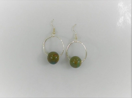 Natural Stone and Silver Hammered Earrings with silver hoops and round green-brown beads suspended at the bottom, shown on a plain white background. Read more at Stamping Cat Studio (stampingcatstudio.com).
