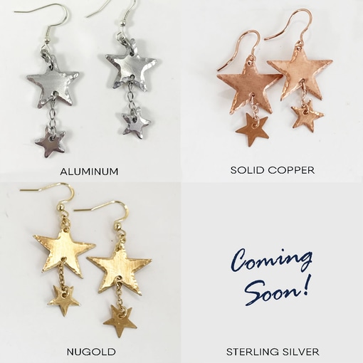 Four images of Shining Star dangle metals are shown. Top left: aluminum. Top right: solid copper. Bottom left: nugold. Bottom right: “Coming Soon!” for sterling silver, with no earrings shown. Each pair links two stars by a chain. Read more at Stamping Cat Studio (stampingcatstudio.com).