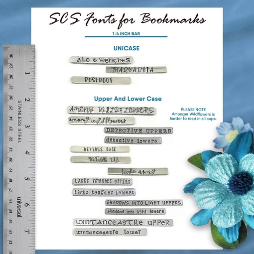 A chart titled "SCS Fonts for Bookmarks" showcases the Faith Inspiration Tassel Bookmark with engraved font samples, grouped as UNICASE and Upper And Lower Case. A ruler at left shows scale, with blue flowers in the bottom right corner. Read more at Stamping Cat Studio (stampingcatstudio.com).